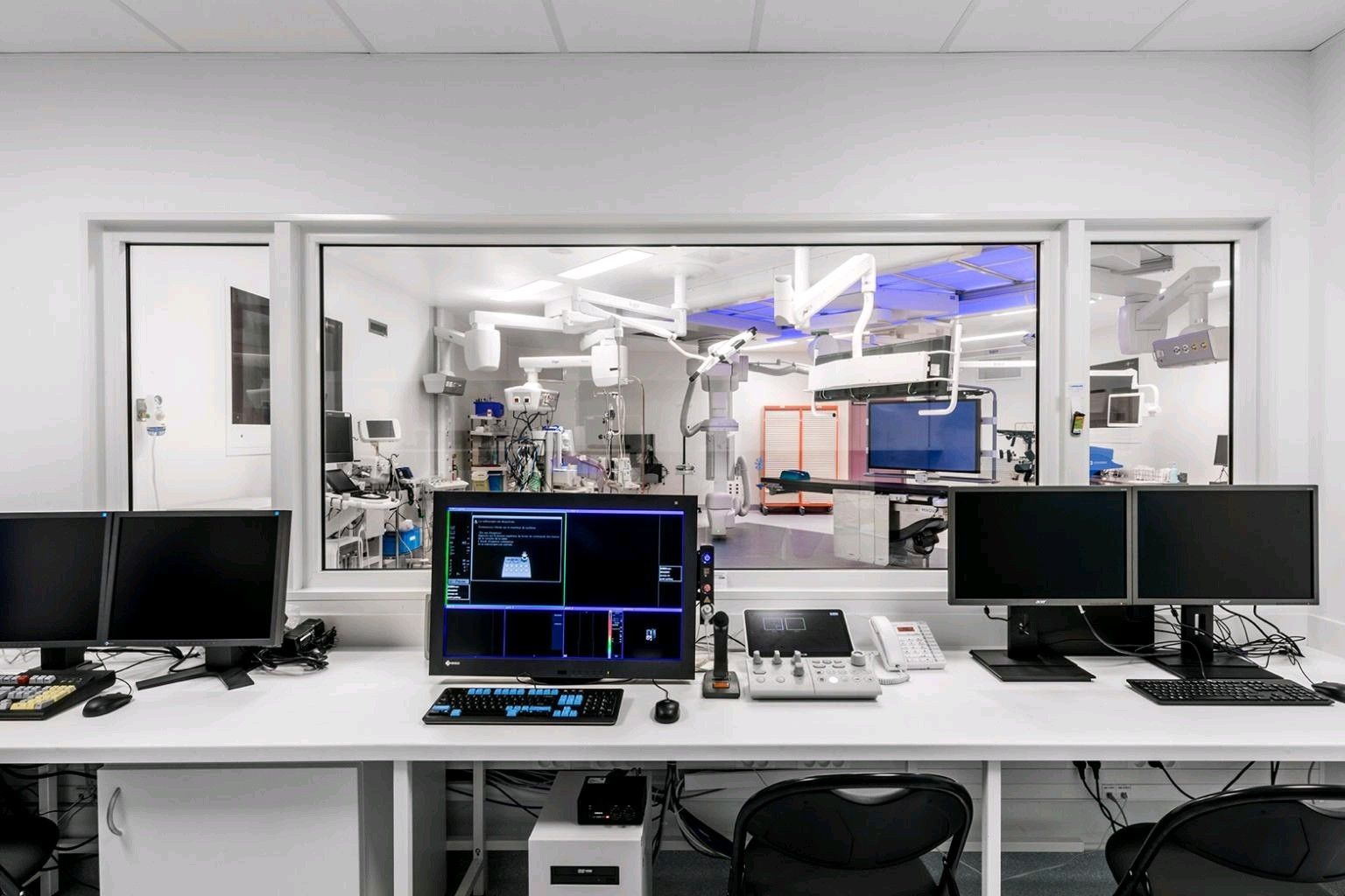 A modern testing room filled with benchmark monitors and computers